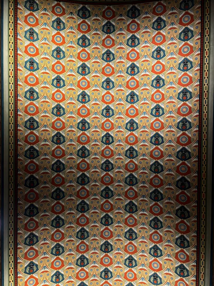 Pattern detail with warm architectural colors and repeated ornament.